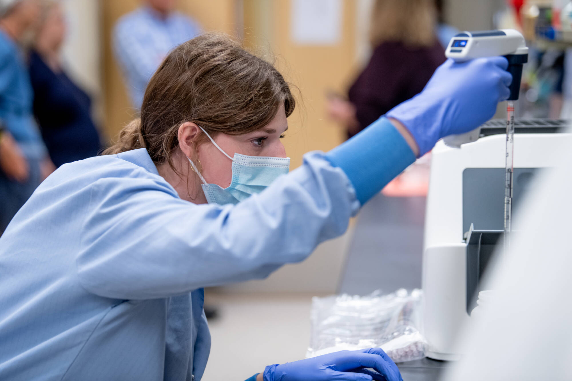 Sara using serologial pipetter.